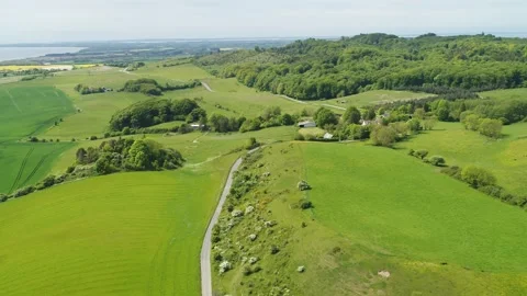Drone flying slowly sideways over beautiful Danish countryside Stock Footage 278364106