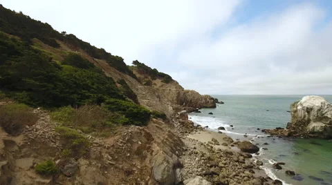 Drone flying straight up over cliff and ocean at Lands End Rocks Cliff Stock-Footage 67163563