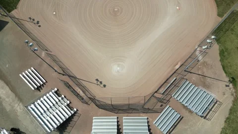 Drone flying straight over empty softball diamond Video stock 246566577