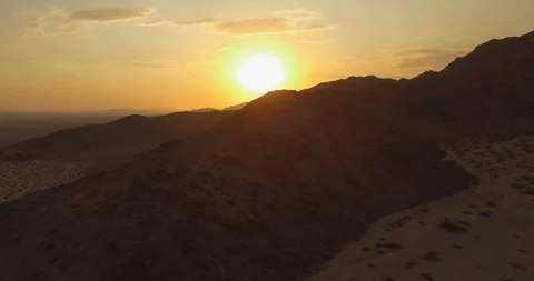 Drone flying into sunset in desert moon landscape Stock Footage 85952765