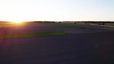 Drone flying in the sunset over the field Stock Footage 276530158