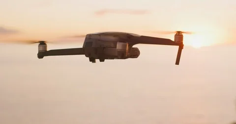 Drone flying at sunset over the ocean Stock Footage 120206091