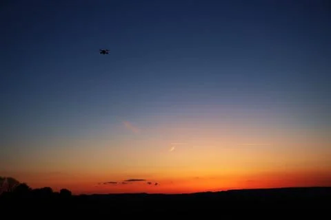 Drone flying into sunset Foto stock