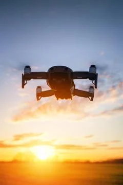 Drone flying on sunset Stock Photos