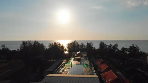 Drone flying up, sunset view over the sea, rooftop pool hotel, Karon, scenery Stock Footage 246968208