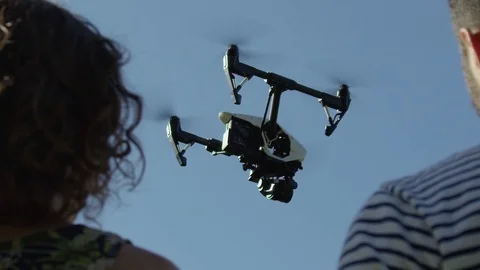 Drone Flying In Super Slow Motion Over The Shoulder Of Two Young Hipster Drone Stock Footage 82593939