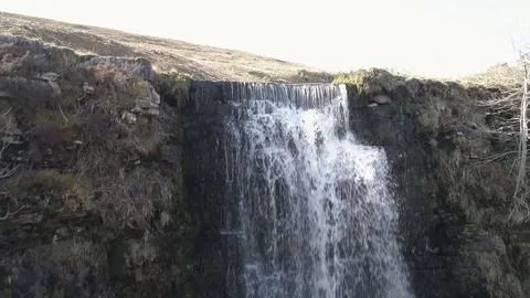 Drone Flying into then up and over a waterfall, Whernside, Yorkshire 60fps Video stock 88952682