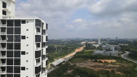 Drone flying through apartment and flying towards highway in Cyberjaya Stock Footage 149380587