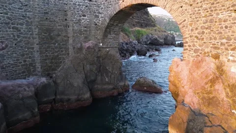 Drone Flying Through Arch at Ponta do Sol Pier – Madeira, Portugal Stock Footage 311435211