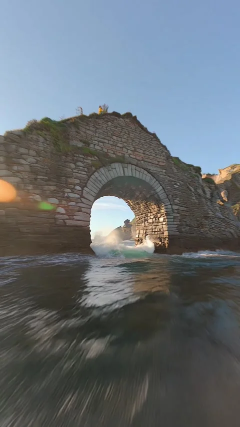 Drone Flying Through Architectures and Stones Above Water Stock Footage 317840712