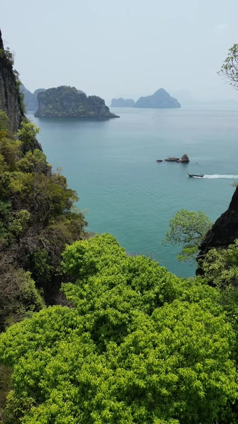 Drone Flying Through a Canyon in Krabi, Thailand Revealing a Tropical Island Bay Stock Footage 335581338