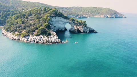 Drone flying through cave at coast with blue crystal clear water and rocks 4 Stock Footage 145669581
