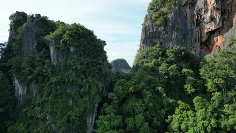 Drone Flying Through Cliffs in Krabi, Ao Nang, Thailand Revealing a Tropical Stock Footage 334777755