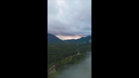 Drone Flying Through a Cloud Over a Valley Stock-Footage 282622967