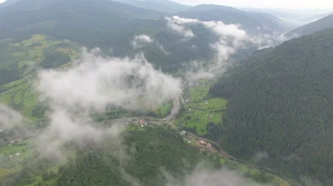 Drone flying through the clouds in the mountains Stock Footage 67230568