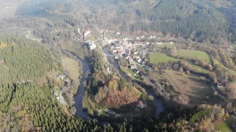 Drone flying through the clouds over the autumn forest and river Stock Footage 257875726