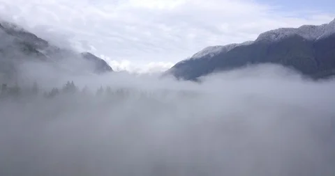 Drone Flying Through Cloudy Valley Stock Footage 100090768