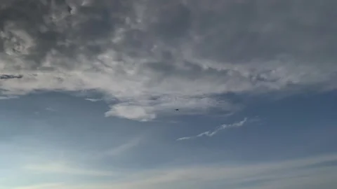 Drone Flying Through Dramatic Clouds in Blue Sky Stock-Footage 332528071