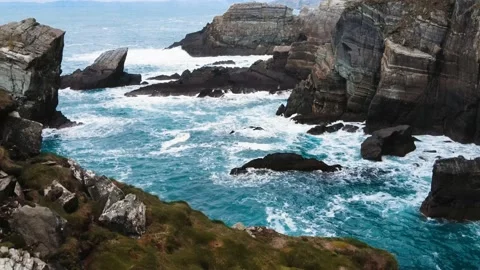 Drone flying through Island cliffs in Ireland, Aerial view near of Mizen Head Stock Footage 233195127