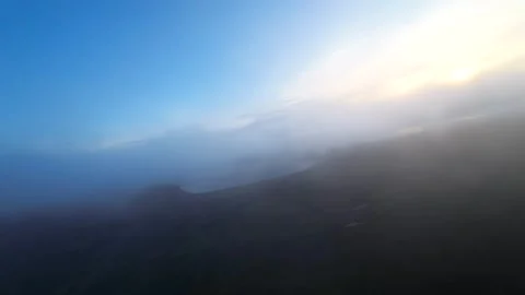 Drone Flying Through Low Cloud and Hazy Sunrise Light Puerto Natales Chile, FPV Stock Footage 341668680