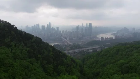 Drone Flying Through Low Clouds Toward Chongqing Skyline and Yangtze River Stock Footage 339598758