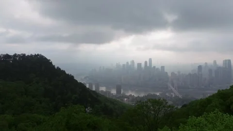 Drone Flying Through Low Clouds Toward Chongqing Skyline and Yangtze River Stock Footage 339746821