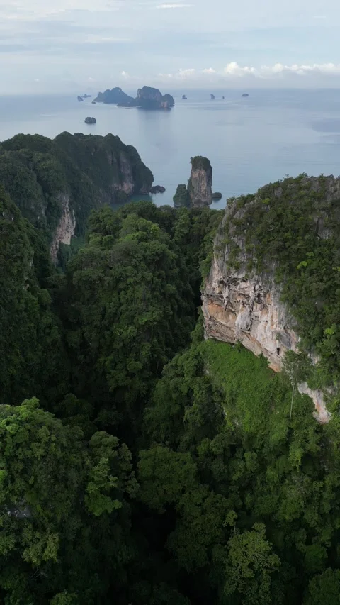 Drone Flying Through a Lush Green Canyon in Ao Nang, Krabi, Thailand Revealing a Stock Footage 334778199