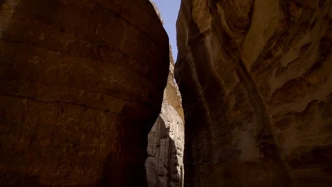 Drone flying through a narrow passage of canyon in the rocks Stock Footage 103522180