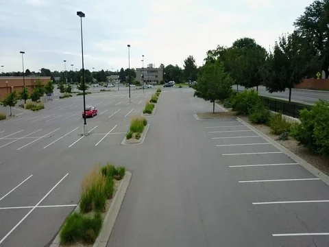 Drone Flying Through Parking Lot Over Trees Stock Footage 78207968