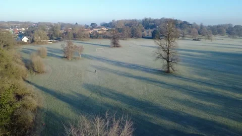 Drone flying through Propsect Park in Reading UK, past drone operator Stock Footage 297589807