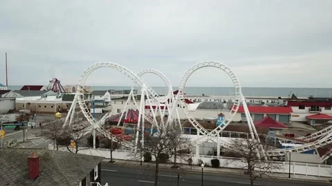 Drone Flying Through Roller Coaster at Amusement Park Stock Footage 133803207