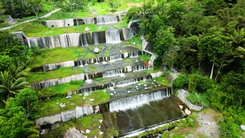 Drone flying through small waterfall with forest tree Stock Footage 291629846