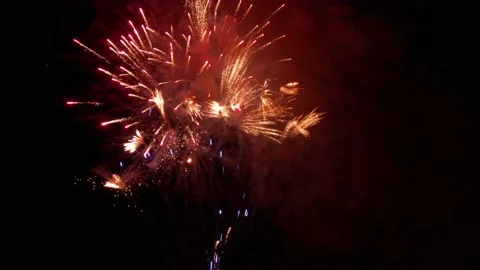 Drone flying through the sparks of fireworks exploding in the night sky. Prep Stock Footage 166648291
