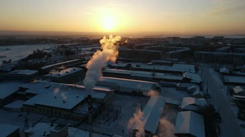 Drone flying through the steam coming from a dairy farm pipe. Stockbeeldmateriaal 148723167