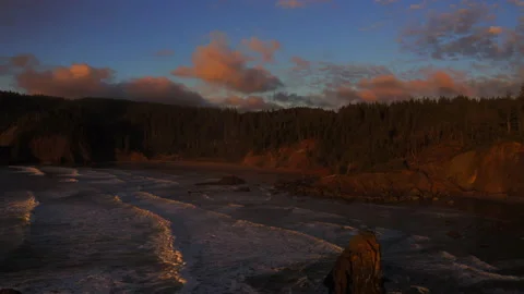Drone flying through the sunset of Canon Beach, Oregon Stock Footage 145819903