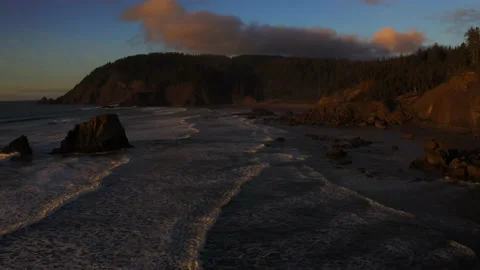 Drone flying through the sunset of Canon Beach, Oregon Stock Footage 145820244