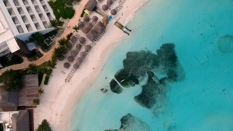 Drone flying through on top of well-desighed Pool at Cancun Resort Stock Footage 94399172