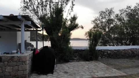 Drone Flying Through Trees Toward Sea at Sunrise in Patmos Vidéo 331661917