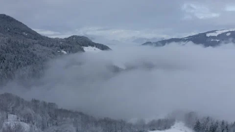 Drone flying through the white mountains and fog in the middle of the french Stock Footage 145699882