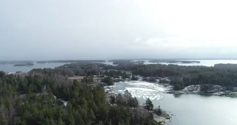 Drone flying thru snowfall. Aerial flight over spring forest Stock Footage 147936039