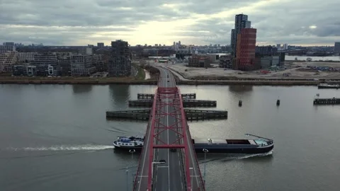 Drone Flying Toward Bridge and City Over River Stock Footage 324792536