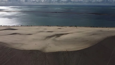 Drone Flying Toward Dune du Pilat with Moving Cloud Shadows on Sand Stock Footage 331661630