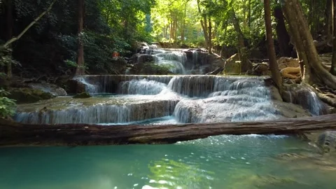 Drone Flying Toward Erawan Waterfall Through Turquoise Pools Vídeo Stock 331940605
