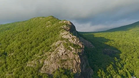 Drone Flying Toward Mountain with Sunlight and Dynamic Clouds Video stock 310964765