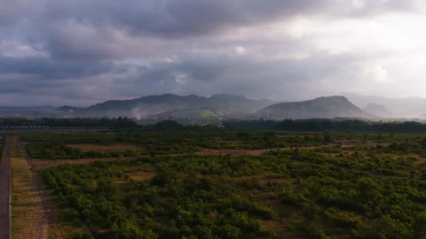 Drone Flying Toward Mountain Under Cloudy Dark Sky Before Rain Stock Footage 344786972