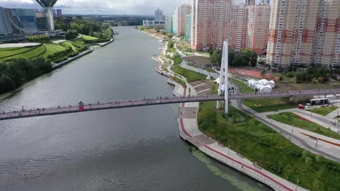 Drone flying toward Pavshinsky Bridge with dynamic downward roll Stock Footage 326938897