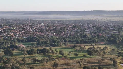 Drone flying toward small countryside city center Stock Footage 330127155