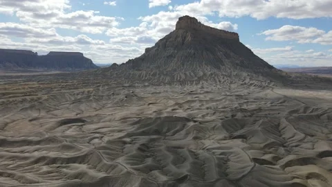 Drone flying toward unique desert plateau in the dry arid desert Stock Footage 153872219