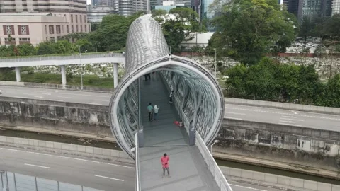 Drone flying towards bridge that connects Kampung Baru and KLCC Stock Footage 150290470