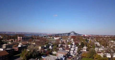 Drone flying towards bridge in Staten Island NY 스톡 동영상 144123052